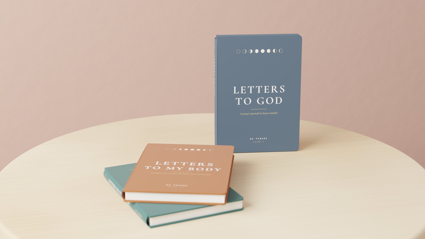 The Letters to God trilogy: three A5 hardcover journals on an oak stool